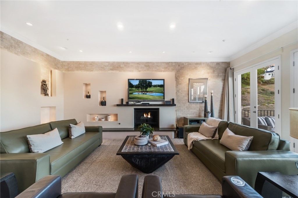 81 Marbella San Clemente, CA 92673 - Photo 9 of 65 a living room with fireplace furniture and a large window