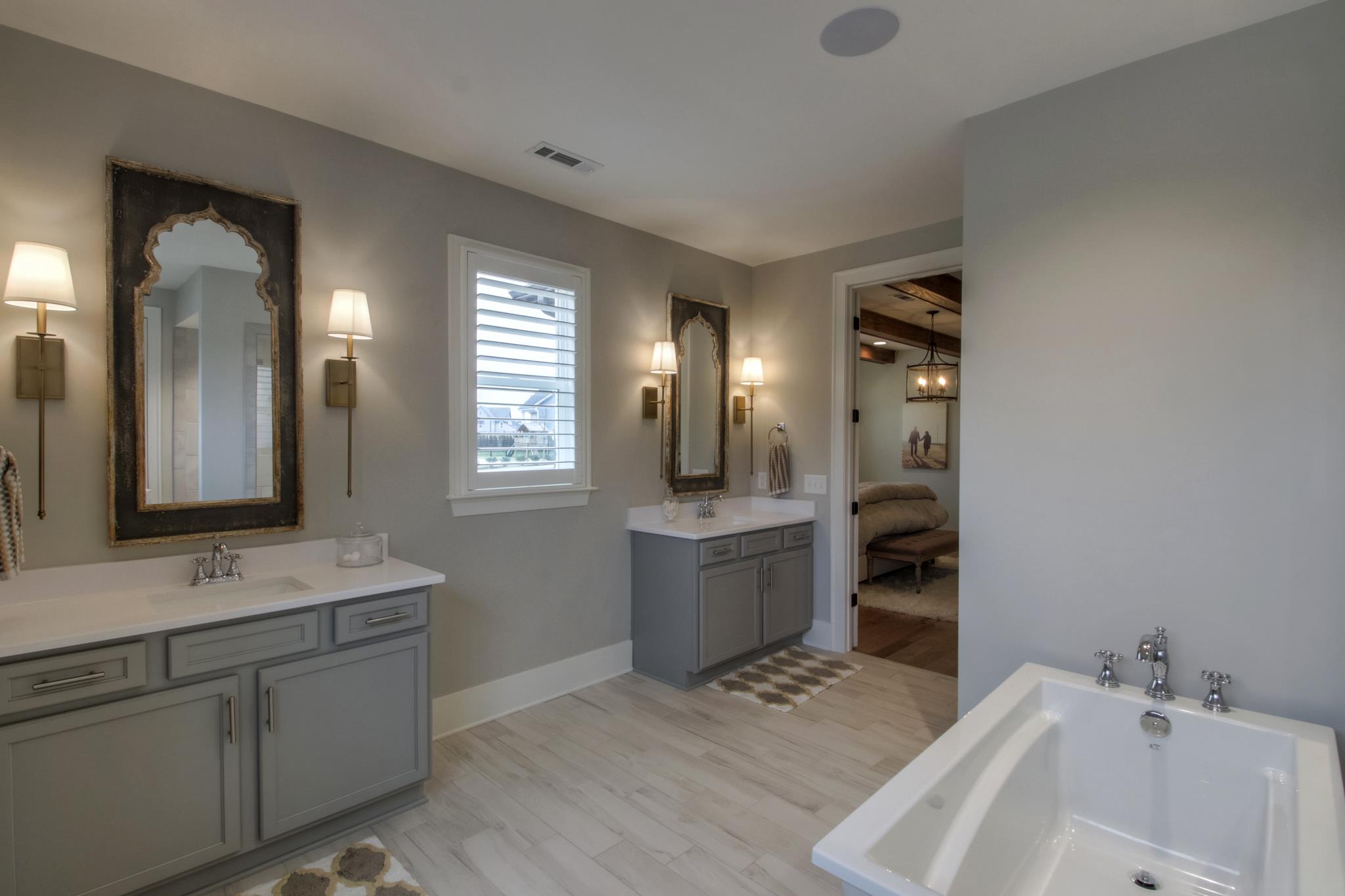 113 Vanner Road Mount Juliet, TN 37122 - Photo 17 of 30 a bathroom with a tub sink and mirror