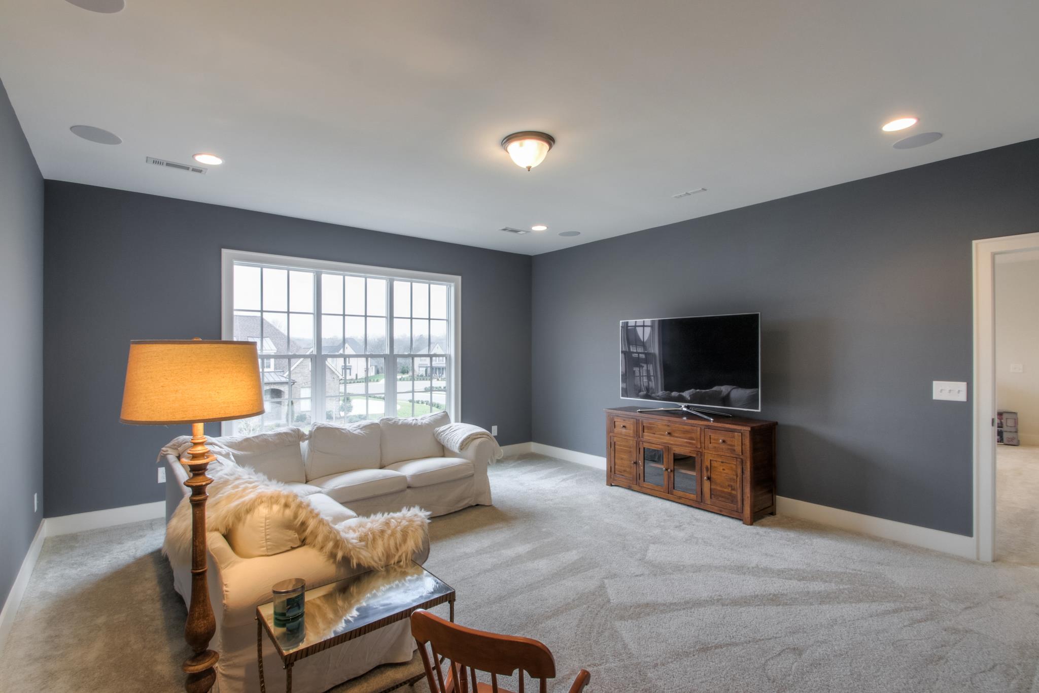 113 Vanner Road Mount Juliet, TN 37122 - Photo 24 of 30 a living room with furniture and a flat screen tv