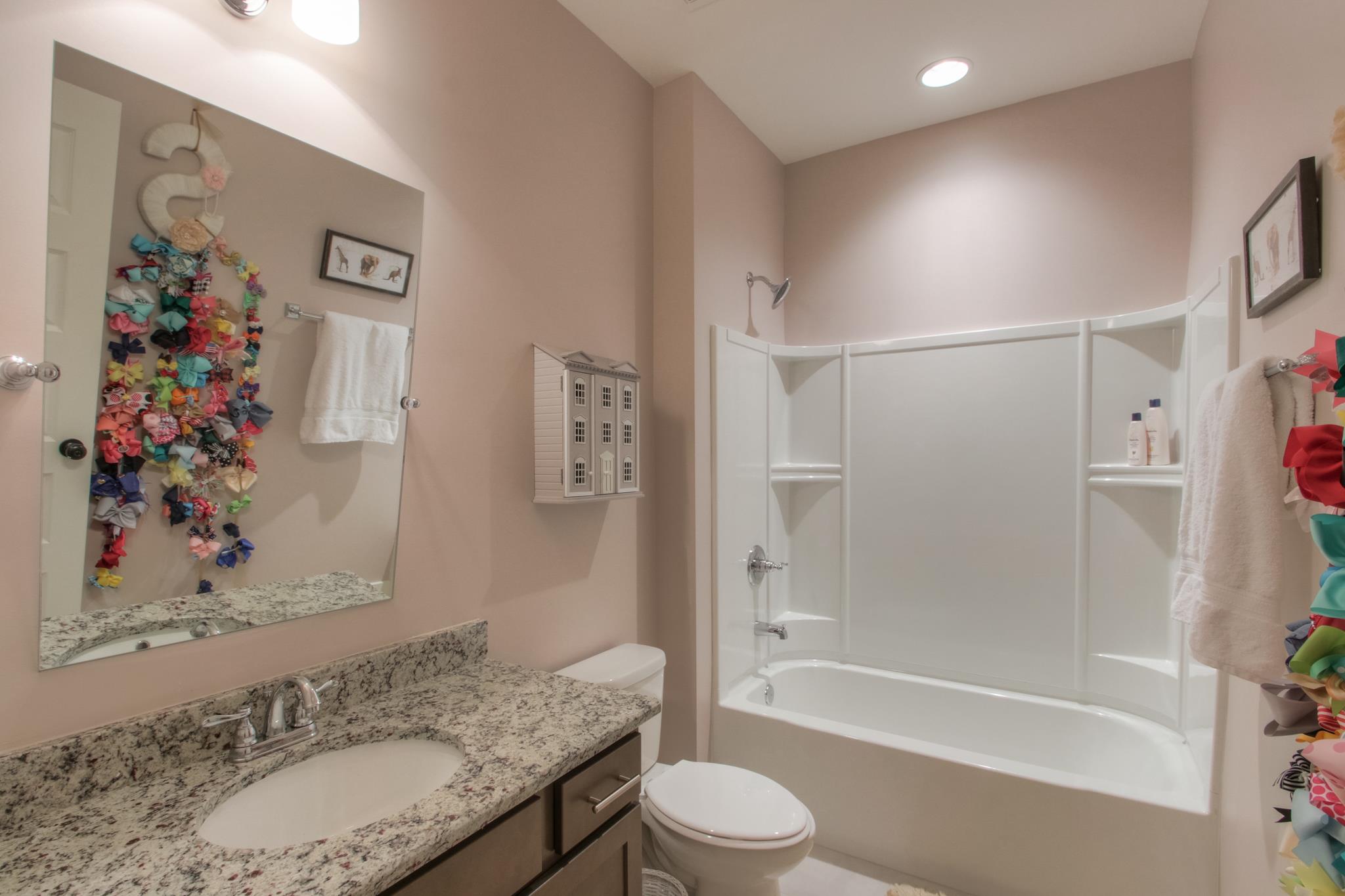 113 Vanner Road Mount Juliet, TN 37122 - Photo 27 of 30 a bathroom with a granite countertop sink toilet and shower