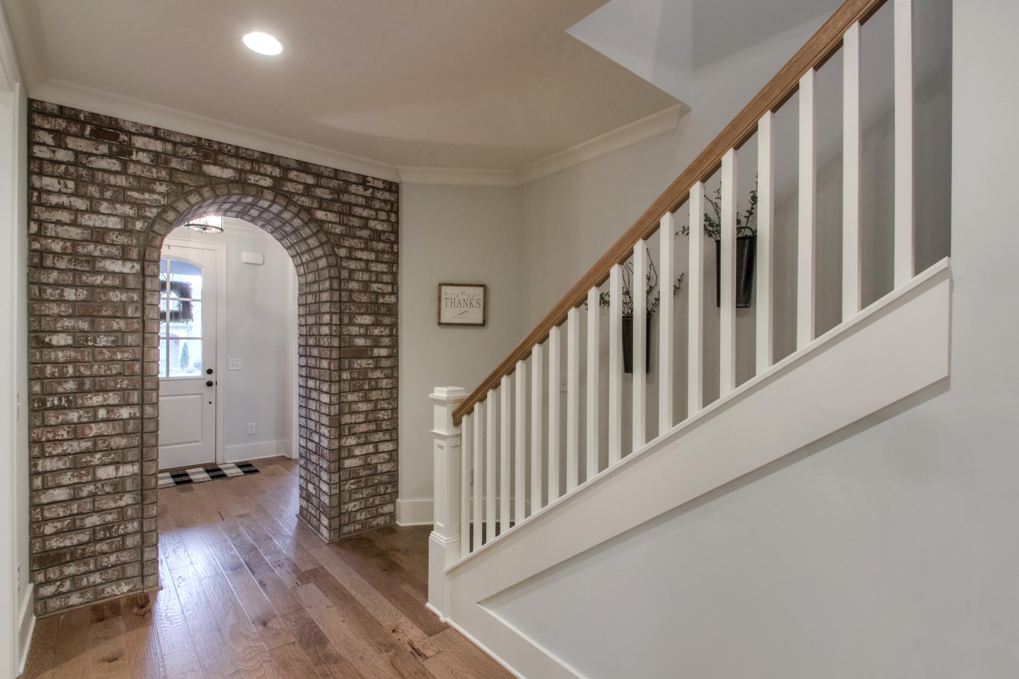 113 Vanner Road Mount Juliet, TN 37122 - Photo 6 of 30 a view of a hallway with wooden floor and staircase