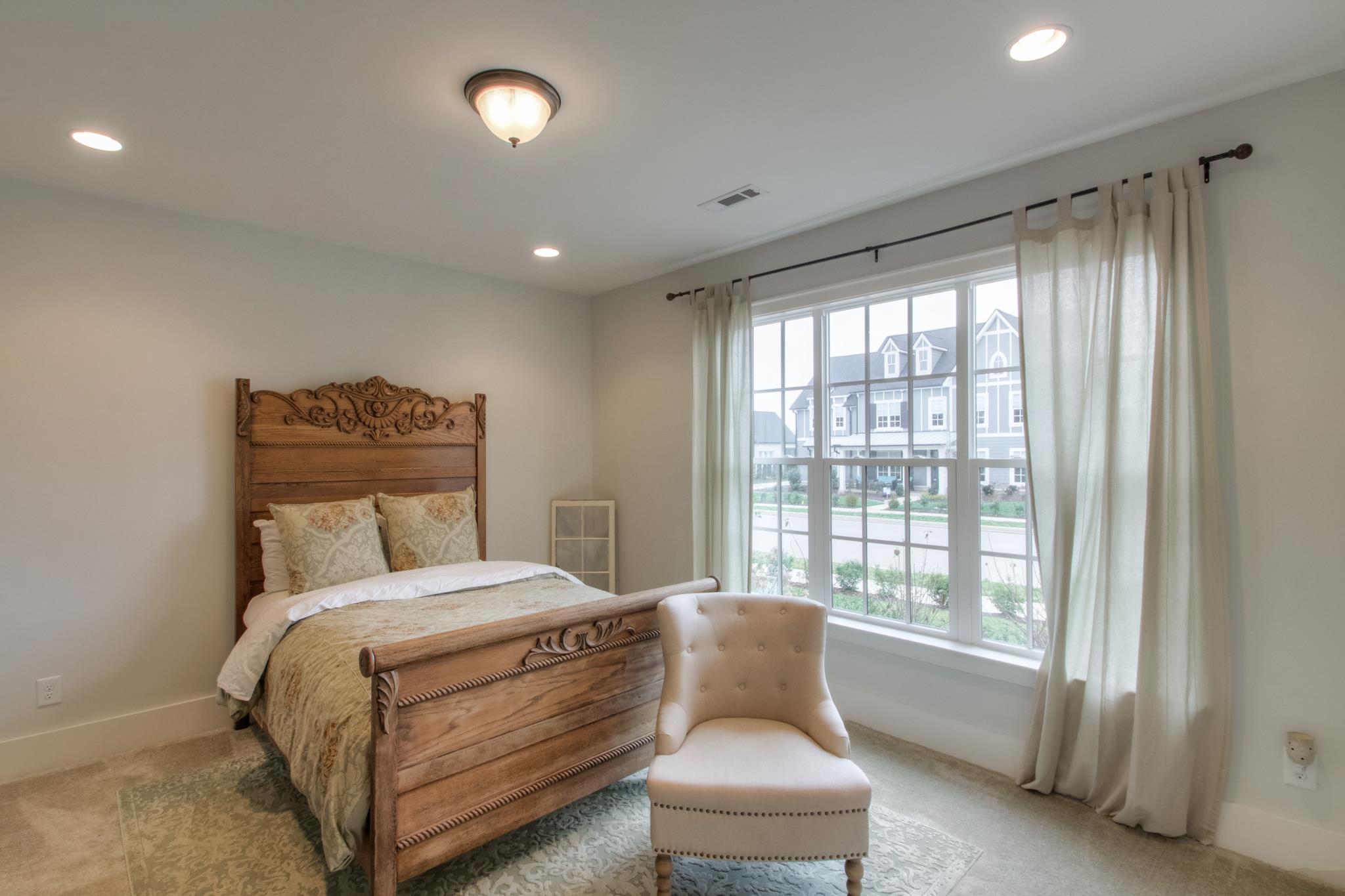 113 Vanner Road Mount Juliet, TN 37122 - Photo 7 of 30 a bedroom with a bed and a large window