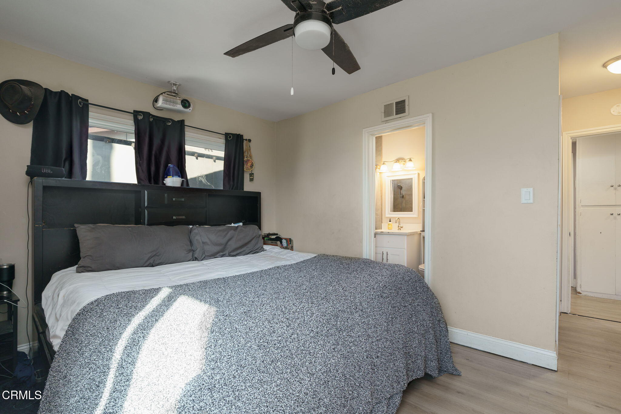 3651 South E Street Oxnard, CA 93033 - Photo 16 of 31 a bedroom with bed and window