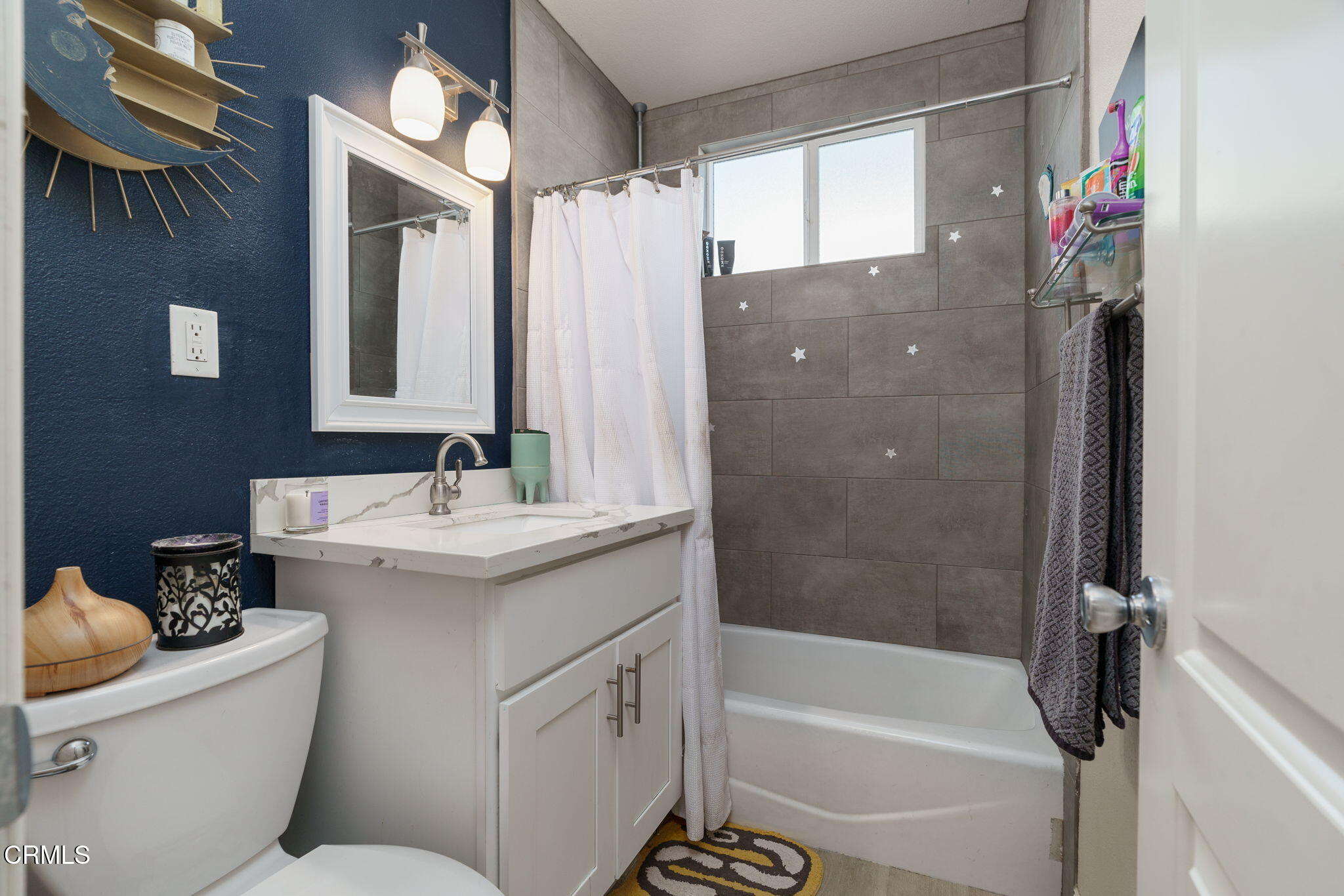 3651 South E Street Oxnard, CA 93033 - Photo 19 of 31 a bathroom with a granite countertop sink toilet and shower