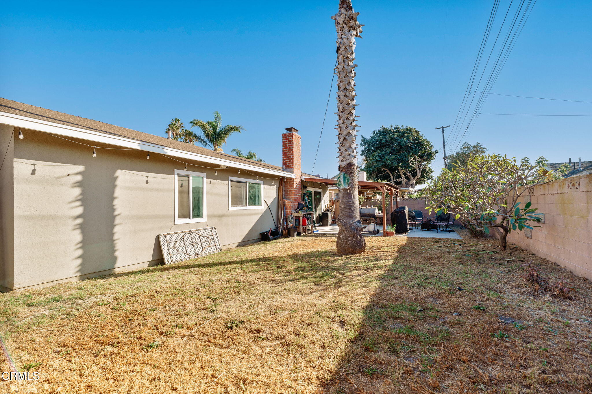 3651 South E Street Oxnard, CA 93033 - Photo 22 of 31 a view of a house with a backyard