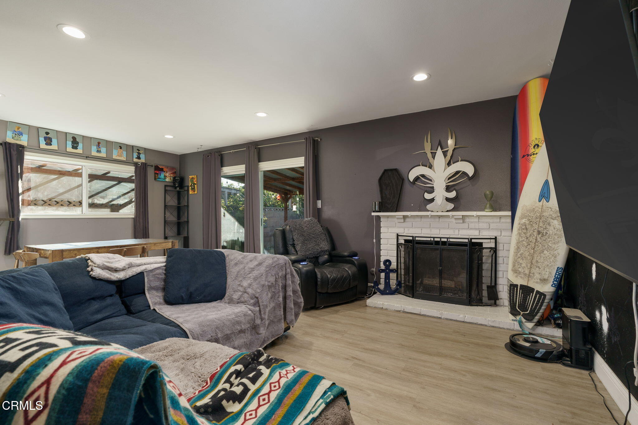 3651 South E Street Oxnard, CA 93033 - Photo 4 of 31 a living room with furniture and a fireplace