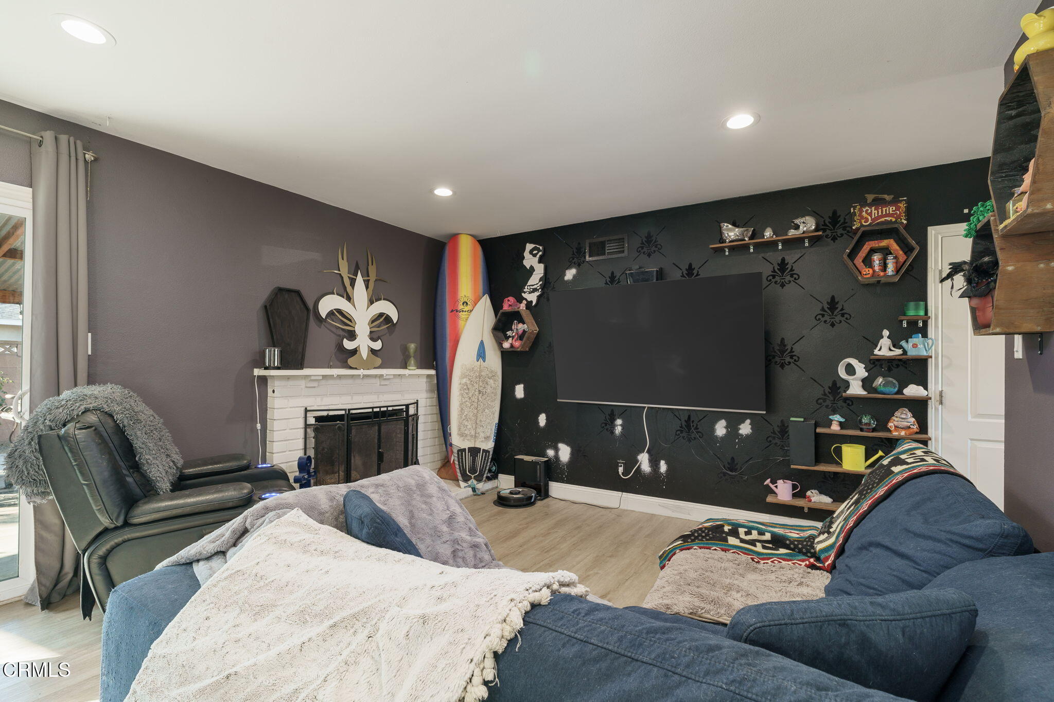 3651 South E Street Oxnard, CA 93033 - Photo 6 of 31 a living room with furniture and a flat screen tv
