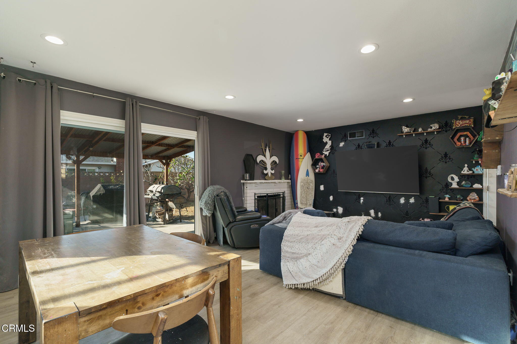 3651 South E Street Oxnard, CA 93033 - Photo 9 of 31 a living room with patio furniture and a flat screen tv