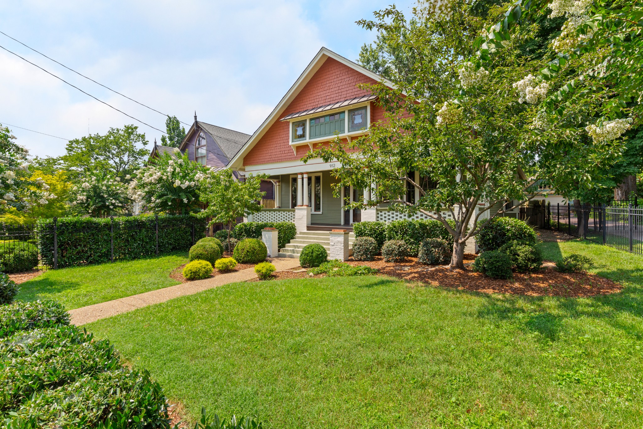 912 South Douglas Avenue Nashville, TN 37204 - Photo 2 of 34 a view of a house with a yard and sitting area