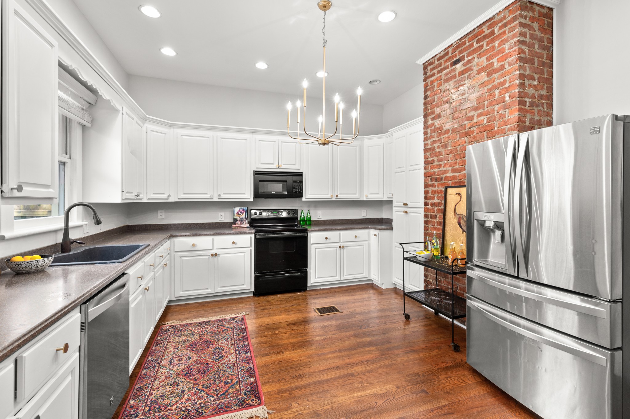 912 South Douglas Avenue Nashville, TN 37204 - Photo 14 of 34 a kitchen with a refrigerator a sink and a stove