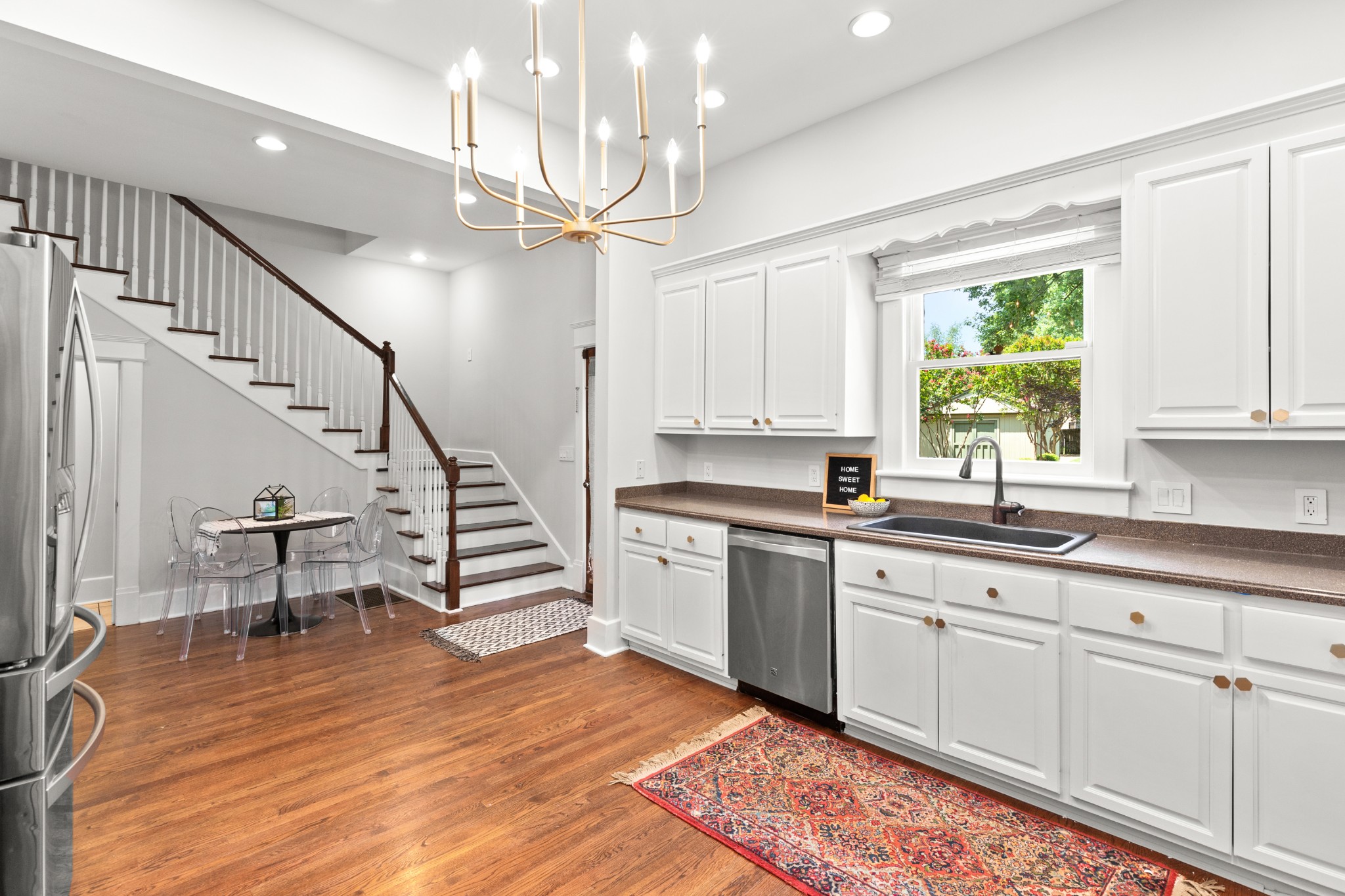 912 South Douglas Avenue Nashville, TN 37204 - Photo 15 of 34 a kitchen with sink cabinets and wooden floor