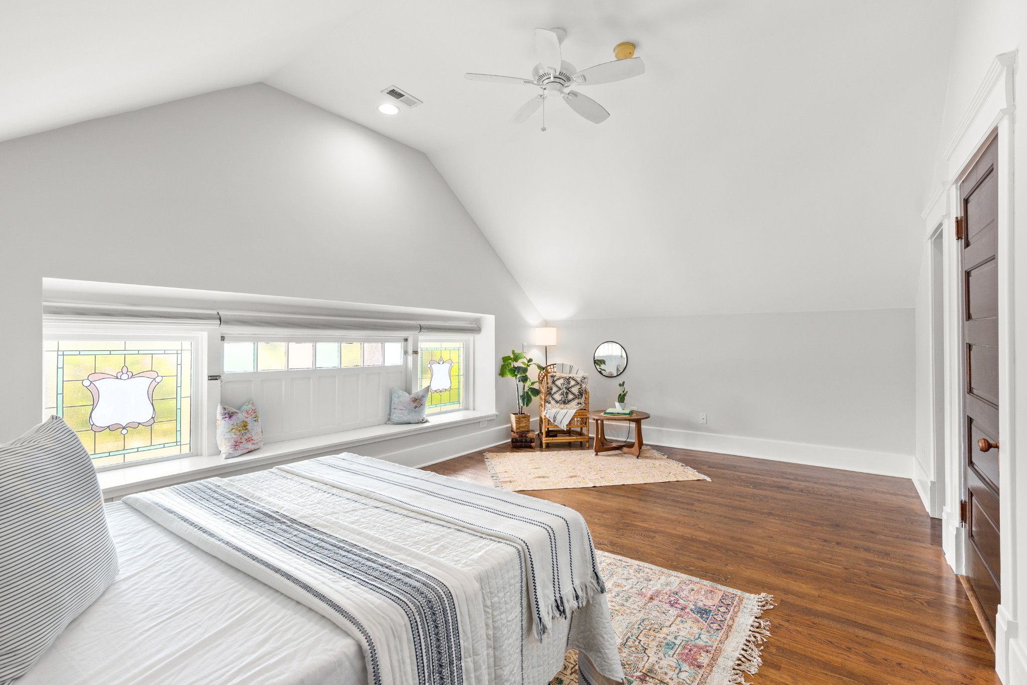 912 South Douglas Avenue Nashville, TN 37204 - Photo 28 of 34 a spacious bedroom with a bed a chandelier and a window