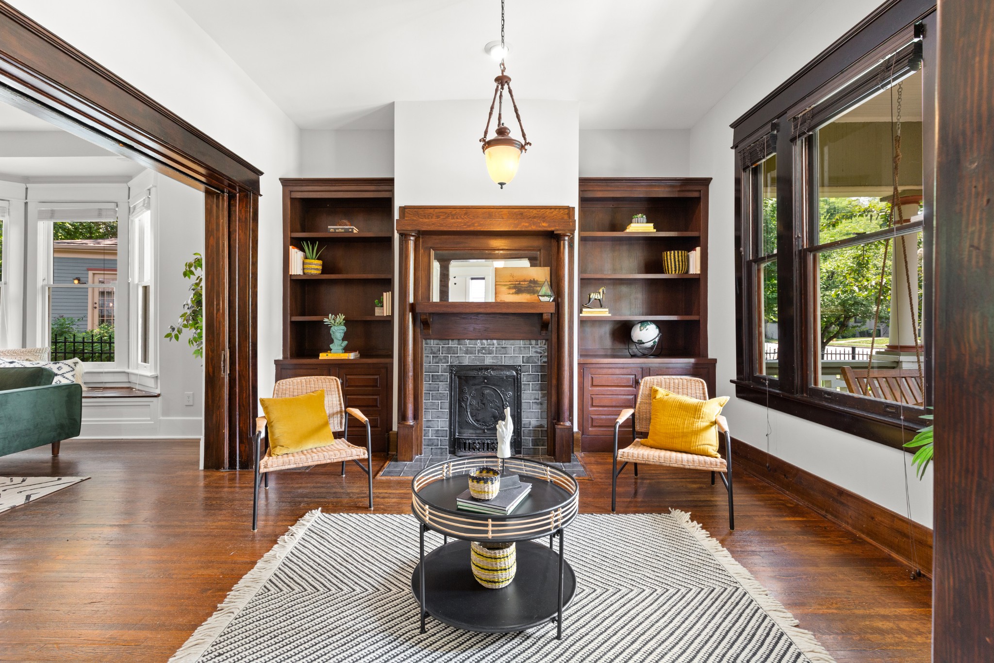 912 South Douglas Avenue Nashville, TN 37204 - Photo 6 of 34 a living room with furniture a fireplace and a table