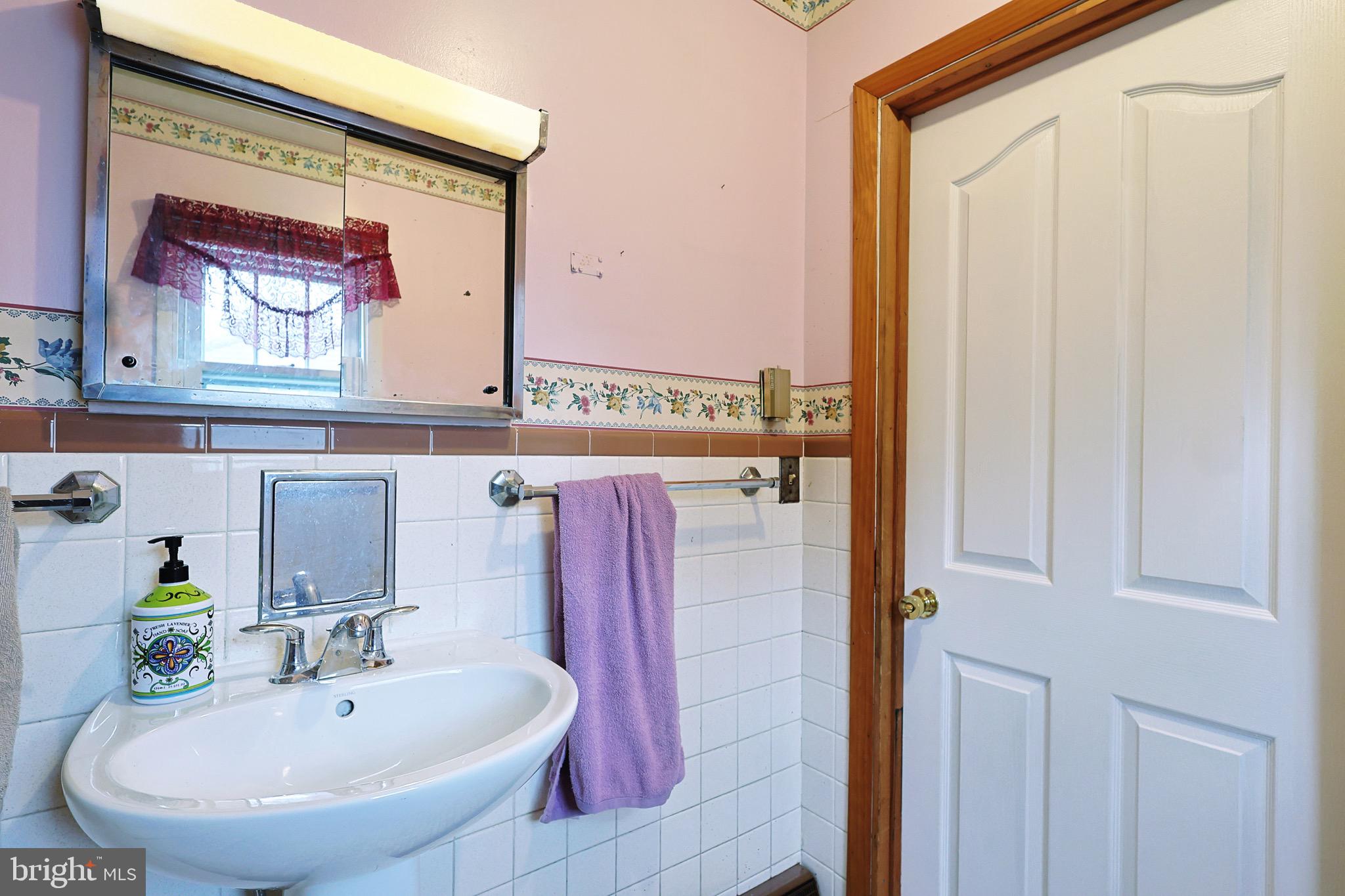 159 Rocket Center Road Keyser, WV 26726 - Photo 34 of 64 a bathroom with a sink and a mirror