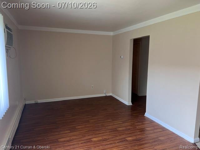 14682 Middle Gibraltar Road, Unit 24 Rockwood, MI 48173 - Photo 5 of 21 Interior space featuring wood-finish flooring, neutral wall tones, and white crown molding