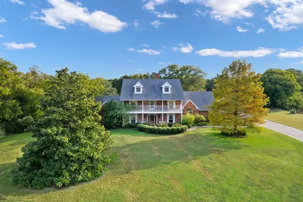 a view of a house with a big yard