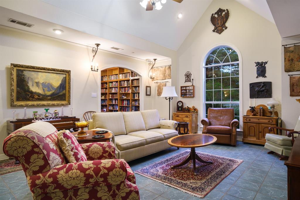 636 East Tripp Road Sunnyvale, TX 75182 - Photo 17 of 40 a living room with furniture ceiling fan and a rug