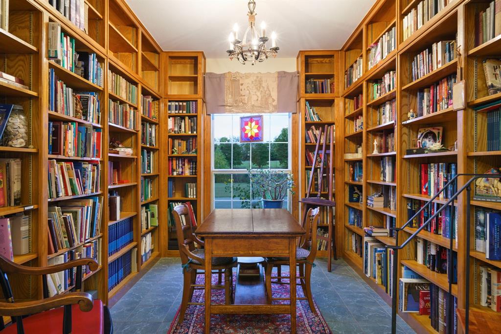 636 East Tripp Road Sunnyvale, TX 75182 - Photo 18 of 40 a view of a dining room with furniture and a book shelf