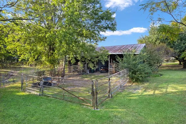 a view of a house with a big yard