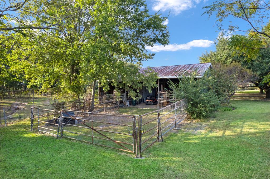 636 East Tripp Road Sunnyvale, TX 75182 - Photo 30 of 40 a view of a house with a yard porch and sitting area