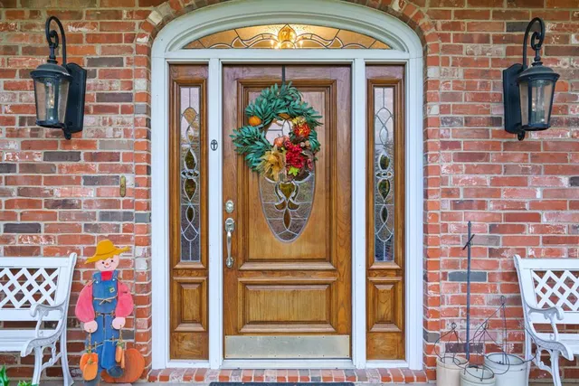 a front view of a house with large windows