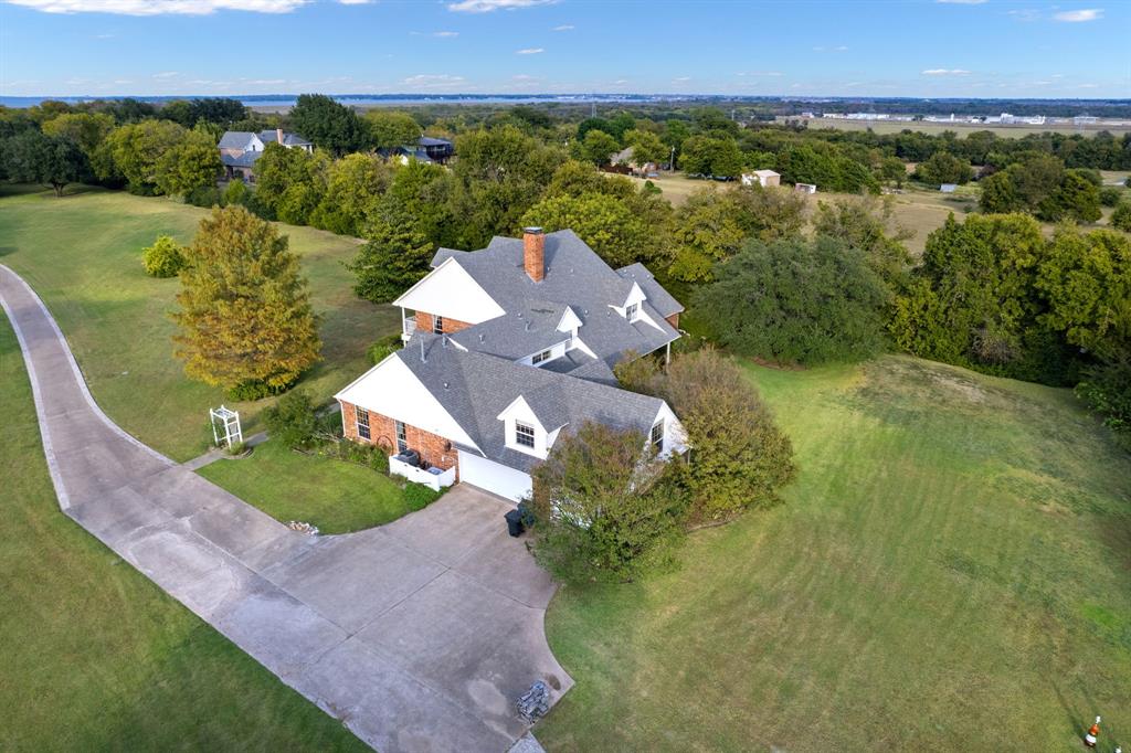 636 East Tripp Road Sunnyvale, TX 75182 - Photo 37 of 40 an aerial view of a house with a yard and lake view