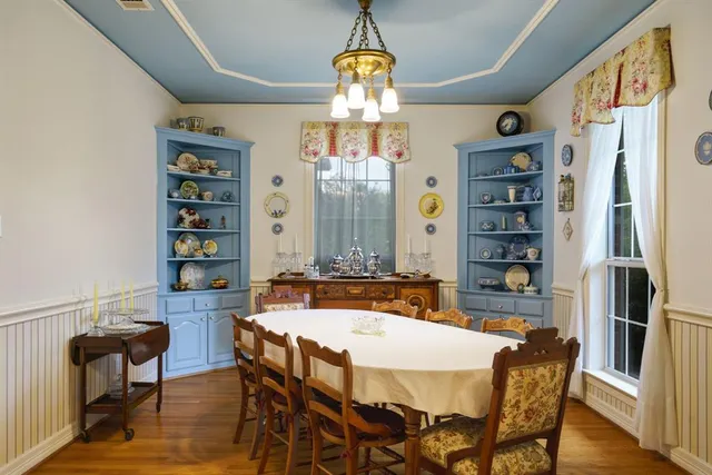 a dining room with furniture and window