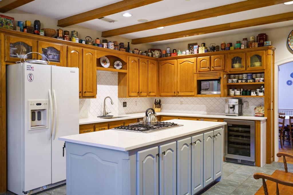 636 East Tripp Road Sunnyvale, TX 75182 - Photo 6 of 40 a kitchen with stainless steel appliances a sink and a refrigerator