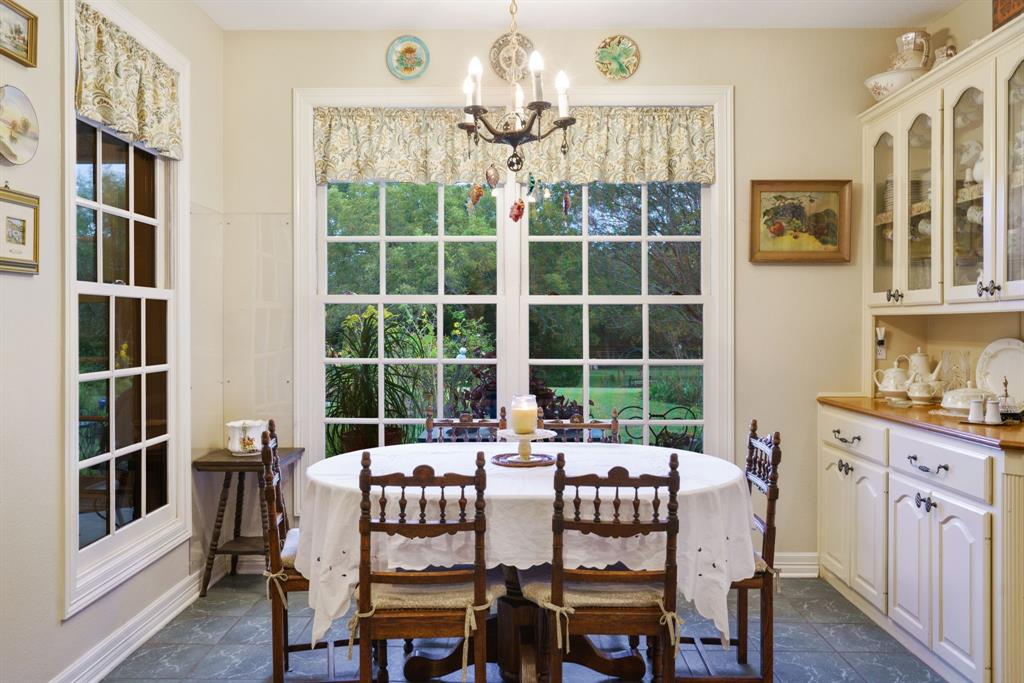 636 East Tripp Road Sunnyvale, TX 75182 - Photo 8 of 40 a view of a dining room with furniture a chandelier and window