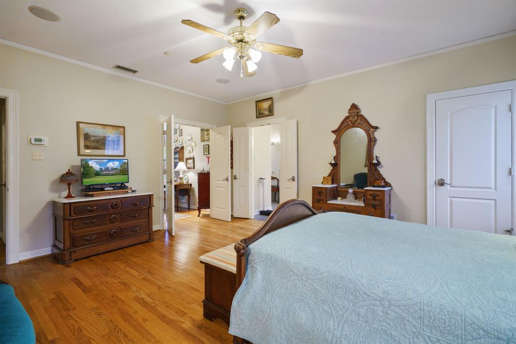 636 East Tripp Road Sunnyvale, TX 75182 - Photo 10 of 40 a bed room with furniture and a chandelier