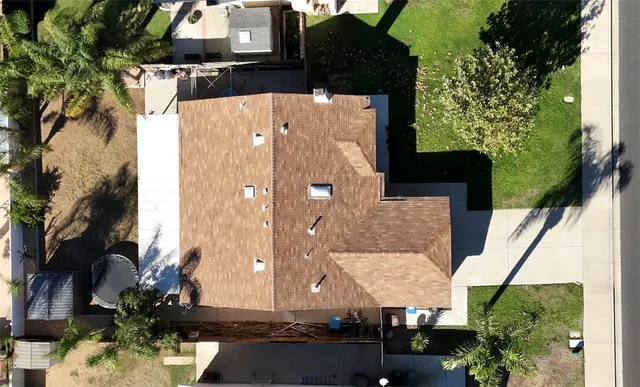 an aerial view of multiple houses with yard
