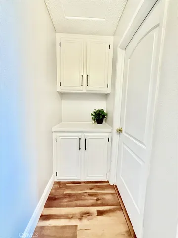 a view of balcony with wooden floor