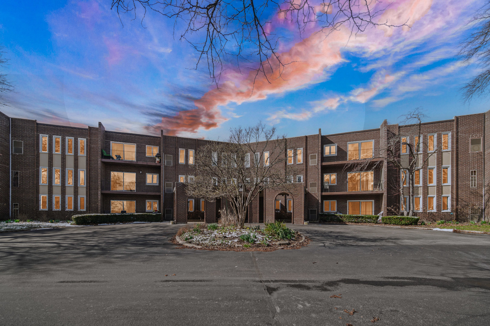 a front view of a building with a street