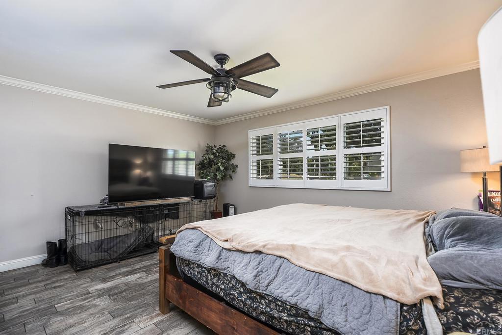 2430 Geyer Lane Alpine, CA 91901 - Photo 21 of 60 a bedroom with a bed and a flat screen tv