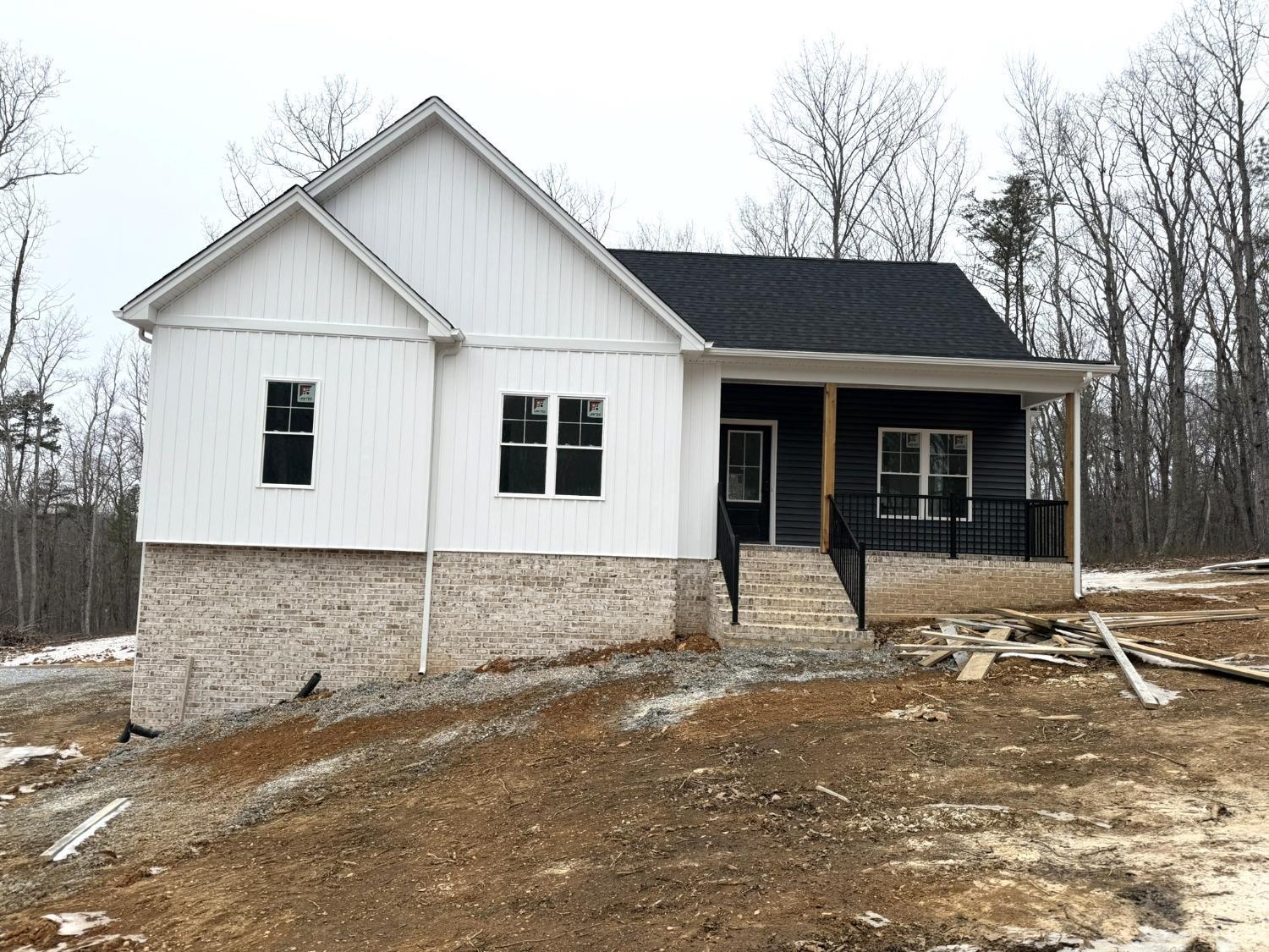 a front view of a house with a sitting area