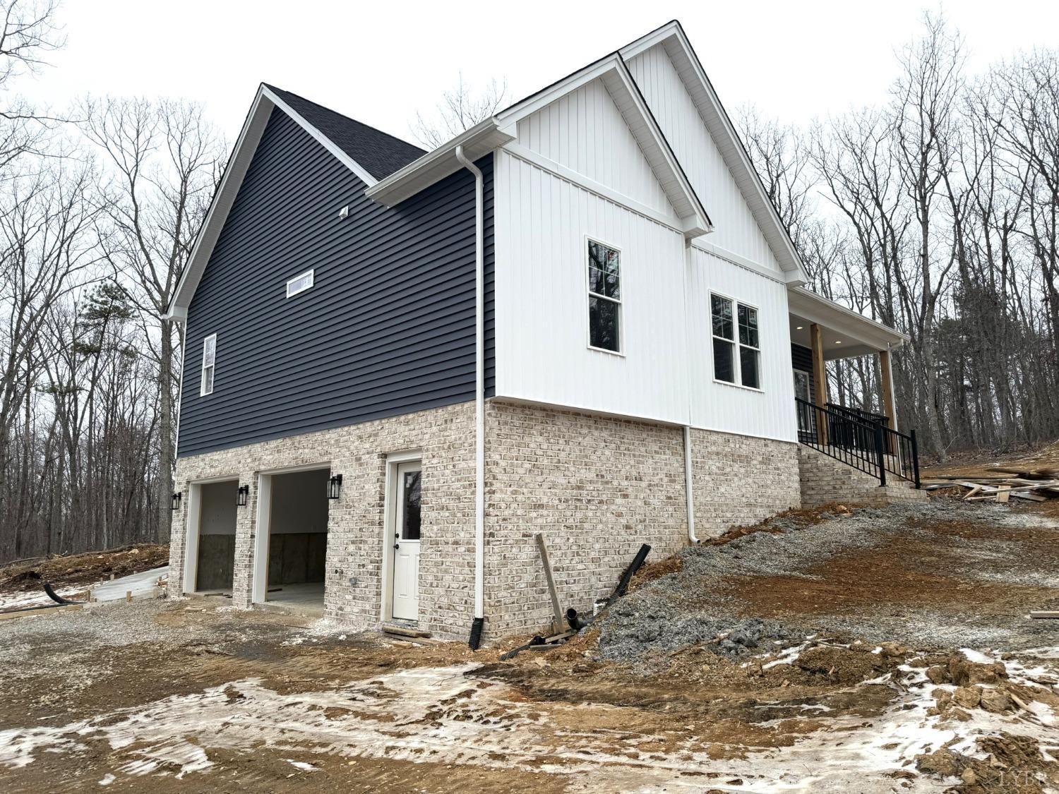 13790 Leesville Road Evington, VA 24550 - Photo 2 of 28 a view of a white house with a large tree front yard