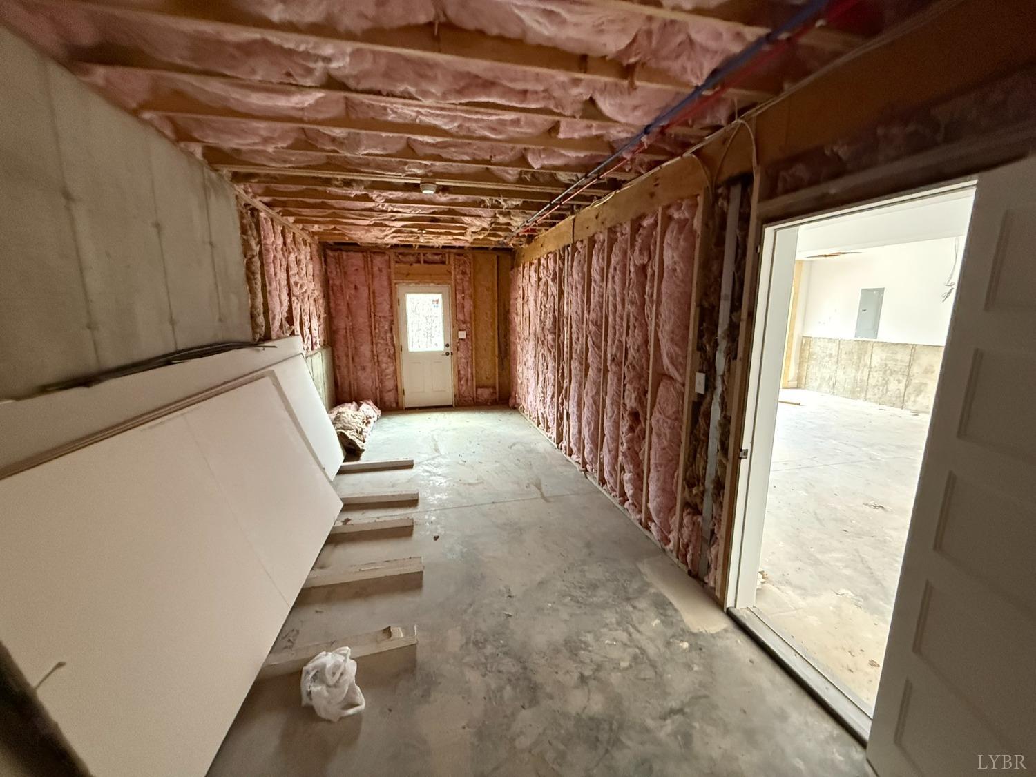 13790 Leesville Road Evington, VA 24550 - Photo 22 of 28 a view of a hallway with wooden walls and windows