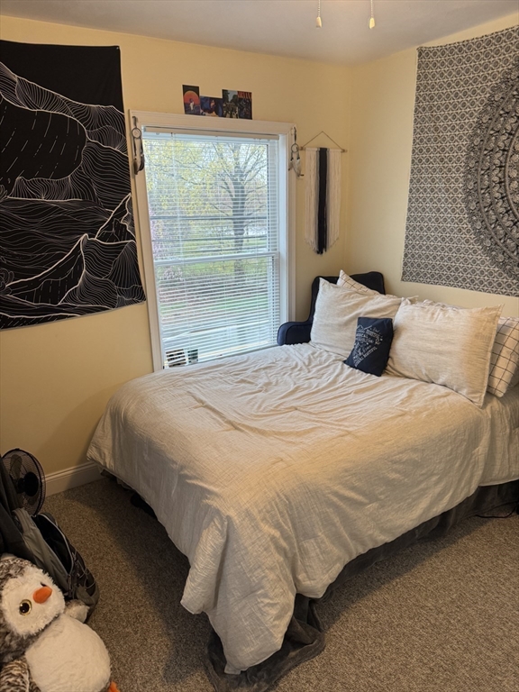 89 Main Street Rowley, MA 01969 - Photo 20 of 39 a bedroom with a bed and a window