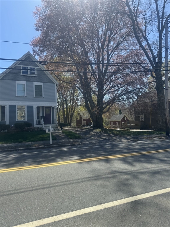 89 Main Street Rowley, MA 01969 - Photo 2 of 39 a view of a house with a yard