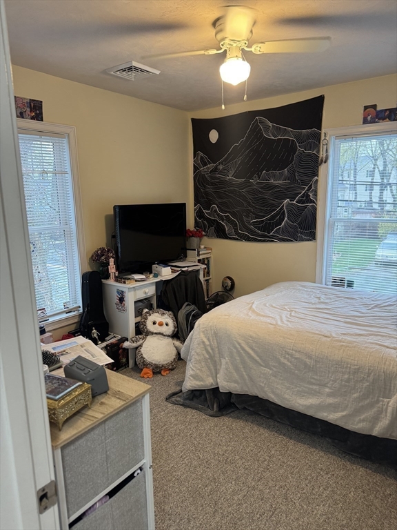 89 Main Street Rowley, MA 01969 - Photo 22 of 39 a bedroom with bed and flat screen tv