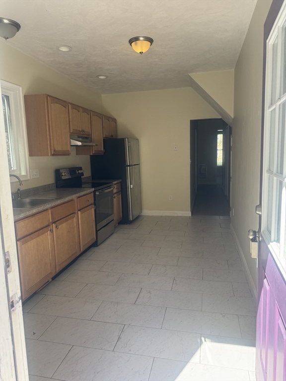 89 Main Street Rowley, MA 01969 - Photo 25 of 39 a kitchen with cabinets and window