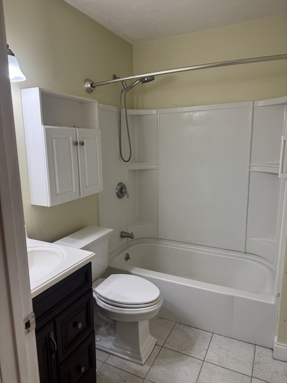 89 Main Street Rowley, MA 01969 - Photo 27 of 39 a bathroom with a toilet a sink and bathtub