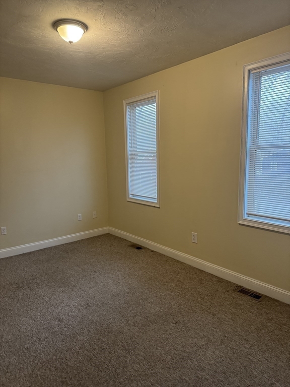 89 Main Street Rowley, MA 01969 - Photo 32 of 39 an empty room with a window