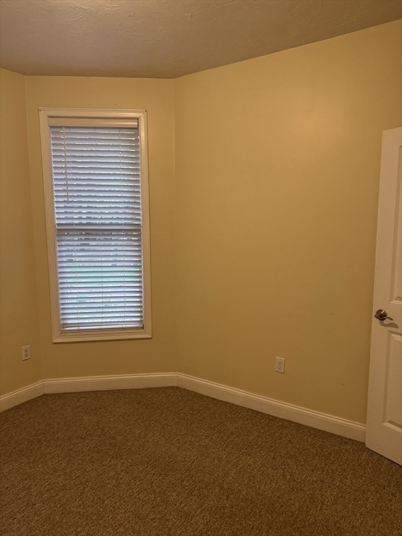 89 Main Street Rowley, MA 01969 - Photo 35 of 39 a view of an empty room with a window