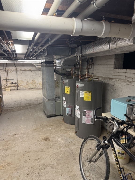 89 Main Street Rowley, MA 01969 - Photo 36 of 39 a storage room with washer and dryer