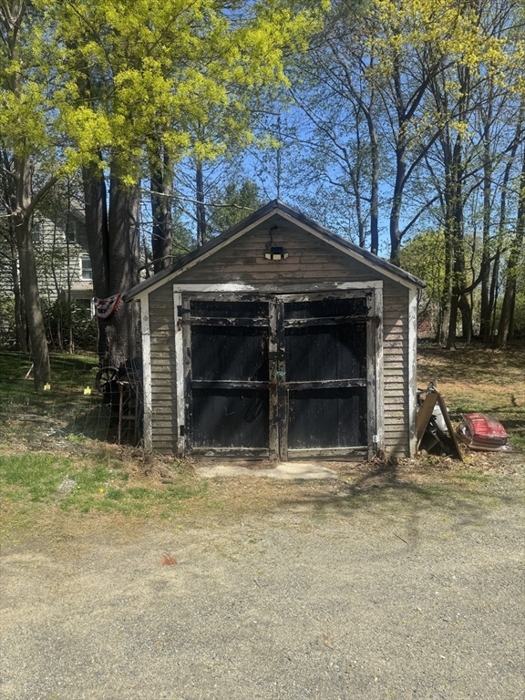 89 Main Street Rowley, MA 01969 - Photo 7 of 39 a view of a house with a yard