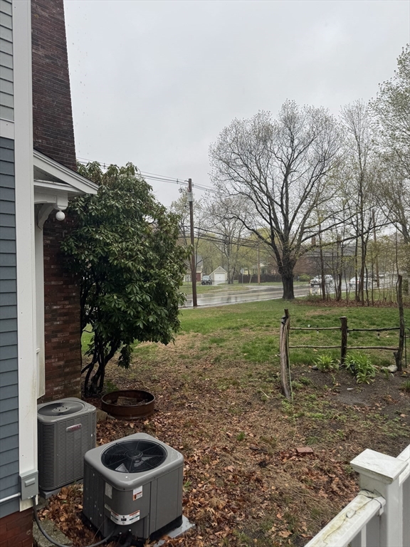 89 Main Street Rowley, MA 01969 - Photo 8 of 39 a view of a backyard with plants and outdoor seating