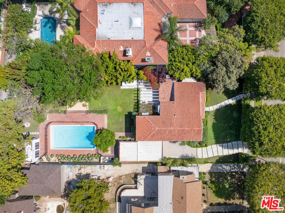 712 North Rodeo Drive Beverly Hills, CA 90210 - Photo 2 of 36 an aerial view of a house with a yard swimming pool and outdoor seating