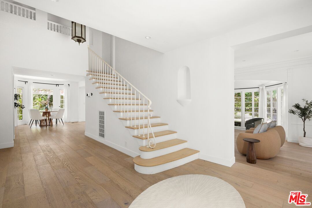 712 North Rodeo Drive Beverly Hills, CA 90210 - Photo 5 of 36 a view of entryway and hall with wooden floor