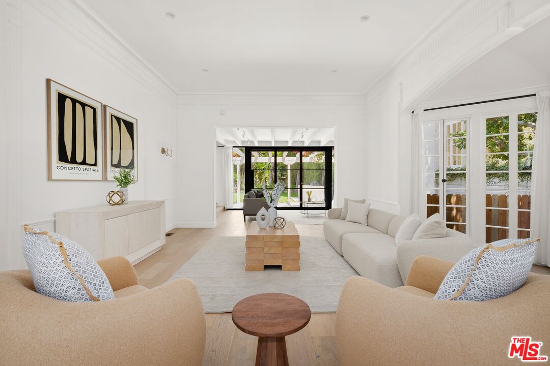 712 North Rodeo Drive Beverly Hills, CA 90210 - Photo 6 of 36 a living room with furniture and a large window